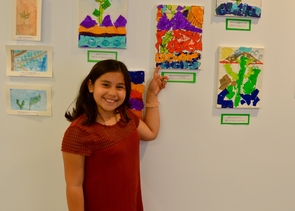 Manzo Elementary School student Valeria Gaona created her painting, “An Expression of Life, LEO, Colors,” as an artistic response to the mini LEO experiments she did with her third-grade class. (Photo: Brieana Sealy) Manzo Elementary School student Valeria Gaona created her painting, “An Expression of Life, LEO, Colors,” as an artistic response to the mini LEO experiments she did with her third-grade class. (Photo: Brieana Sealy)